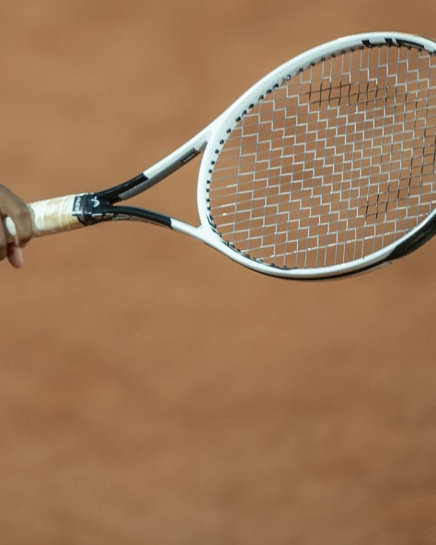 Sep 27, 2020; Paris, France; Cori Gauff (USA) reaches for the ball prior to her serve during her match against Johanna Konta (GBR) on day one at Stade Roland Garros. Mandatory Credit: Susan Mullane-USA TODAY Sports